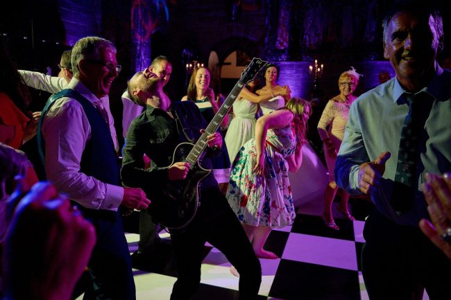 Supercharged Wedding Band on the Dance Floor with guests dancing