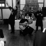 Singing waiters in black and white